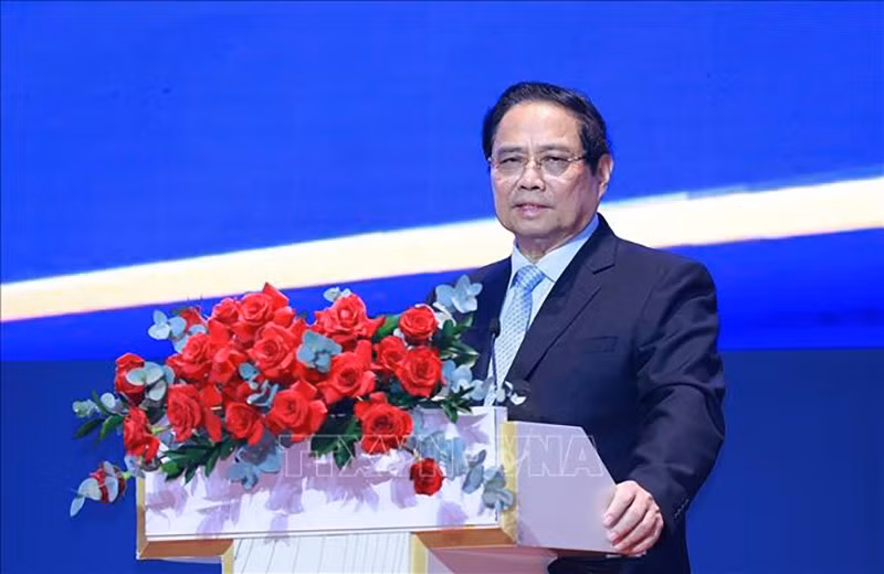 Премьер-министр Фам Минь Тьинь выступает на конференции. Фото: ВИА