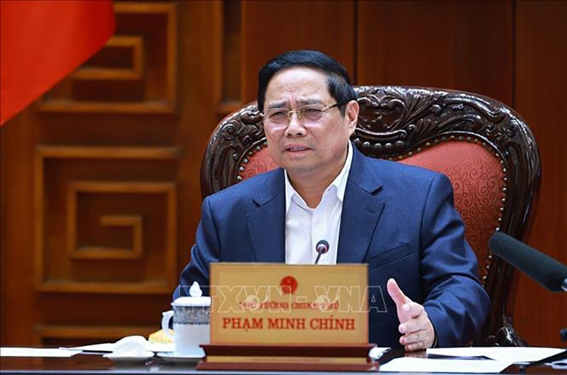 Премьер-министр Фам Минь Тьинь выступает на заседании. Фото: ВИА 