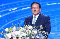 Премьер-министр Фам Минь Тьинь выступает на 4-й церемонии вручения премии VinFuture в Ханое 6 декабря. Фото: ВИA