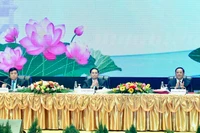 Конференция прошла под сопредседательством Премьер-министра Фам Минь Тиня и Премьер-министра Лаоса Сонексай Сипхандона. Фото: Тхань Жанг
