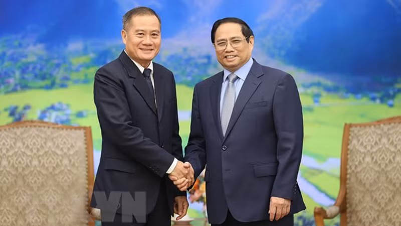 Премьер-министр Фам Минь Тьинь принимает Генерального директора «Pathet Lao» Кхамфея Филафу. Фото: ВИА