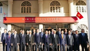 Делегаты Вьетнама и Лаоса на переговорах. (Фото: ВИА)