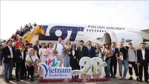 Церемония встречи 20-миллионного международного туриста во Вьетнаме. (Фото: ВИА)