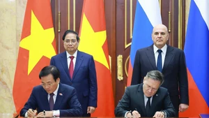 [Фото] Церемония подписания соглашения о сотрудничестве в строительстве атомной электростанции между Вьетнамом и Россией