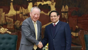 Премьер-министр Фам Минь Тьинь принимает г-на Яня Цзехэ, основателя корпорации «Тайпинъян». Фото: ВИА