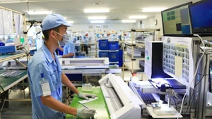 Производство электронных устройств на предприятии Rhythm Precision Vietnam Co., Ltd. в промышленной зоне Нойбай (Ханой). Фото: hanoimoi.vn