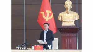 Постоянный член Секретариата ЦК КПВ Чан Кам Ту выступает на рабочей встрече с представителями соответствующих органов. Фото: ВИА