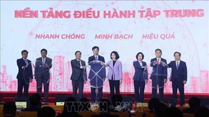 Делегаты проводят церемонию запуска централизованной операционной платформы для работы делегации депутатов НС и Народного совета двух уровней. Фото: ВИА 