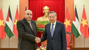 Генеральный секретарь ЦК КПВ То Лам принимает Председателя Палаты представителей Иордании Мазена Турки Эль-Кади. Фото: Зюи Линь