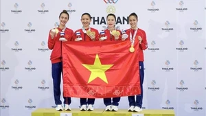 Спортсменки Хоанг Тхи Ми Там, Динь Ти Хыонг, Нгуен Тхи Зиеу Ли и Нгуен Тхи Ту показали выдающиеся результаты на 33-х Играх Юго-Восточной Азии, обыграв 14 декабря хозяев турнира, сборную Таиланда, со счетом 2:0 и завоевав золотую медаль. Фото: ВИA