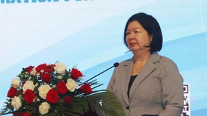 Председатель Союза кооперативов Вьетнама Као Суан Тху Ван выступает на семинаре 2 декабря. Фото: ВИА