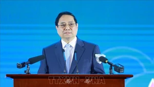 Премьер-министр Вьетнама Фам Минь Тьинь выступает на форуме. Фото: ВИА