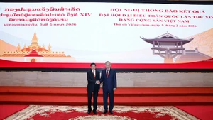 Генеральный секретарь ЦК КПВ То Лам и Генеральный секретарь ЦК НРПЛ, Президент Лаоса Тхонглун Сисулит на конференции. Фото: ВИА