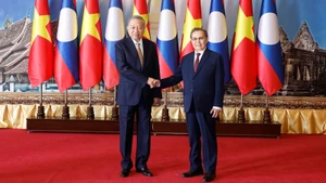 Генеральный секретарь ЦК КПВ То Лам и Председатель НА Лаоса Сайсомфон Фомвихан. Фото: ВИА