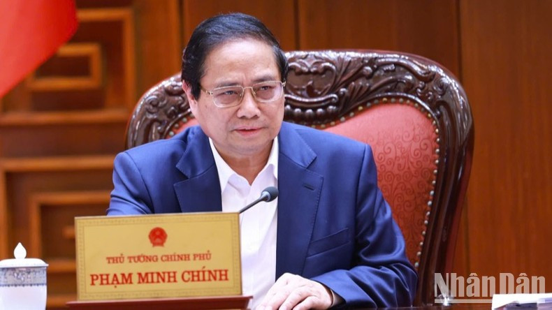 Премьер-министр Фам Минь Тьинь выступает с речью. Фото: Чан Хай Премьер-министр Фам Минь Тьинь выступает с речью. Фото: Чан Хай
