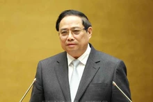 Премьер-министр Правительства Фам Минь Тьинь выступает на конференции. Фото: ВИА