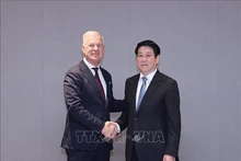 Президент Вьетнама Лыонг Кыонг и Генеральный секретарь ICC Джон Дентон. Фото: ВИА