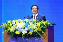 Премьер-министр Фам Минь Тьинь выступает на заседании высокого уровня. Фото: ВИА