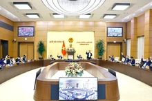 Постоянный комитет Национального собрания проводит голосование. Фото: ВИА