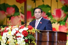 Премьер-министр Фам Минь Тьинь выступает на конференции. Фото: Чан Хай