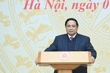 Премьер-министр Фам Минь Тьинь выступает на конференции. Фото: Чан Хай