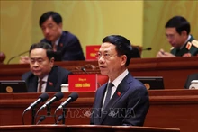 Министр науки и технологий Нгуен Мань Хунг представляет доклад. Фото: ВИА