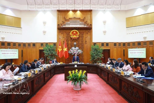 Премьер-министр Фам Минь Тьинь председательствует на третьем заседании Национального руководящего комитета по всеобъемлющему финансированию. (Фото: ВИА)