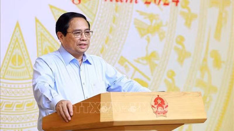 Премьер-министр Фам Минь Тьинь выступает на конференции. Фото: ВИА