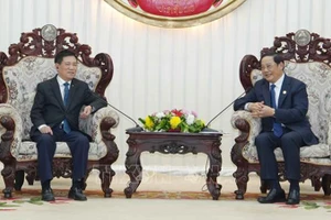 Вице-премьер Вьетнама Хо Дык Фок и Премьер-министр Лаоса Сонексай Сипхандон. Фото: ВИА