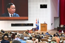 Заместитель главного прокурора Верховной народной прокуратуры Та Куанг Кхай выступает на заседании. Фото: ВИА