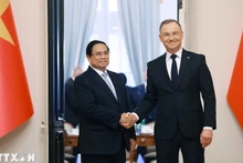 Премьер-министр Фам Минь Тьинь и Президент Польши Анджей Дуда. Фото: ВИА