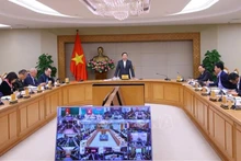 Вице-премьер Чан Хонг Ха председательствует на конференции. Фото: ВИА