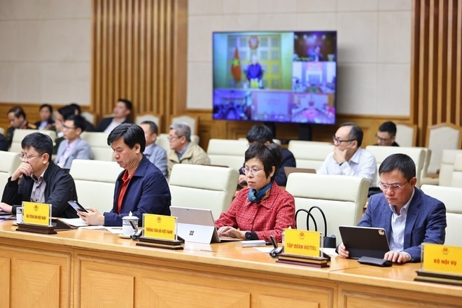 Члены Национального руководящего комитета по гражданской обороне на онлайн-совещании. (Фото: ВИА)