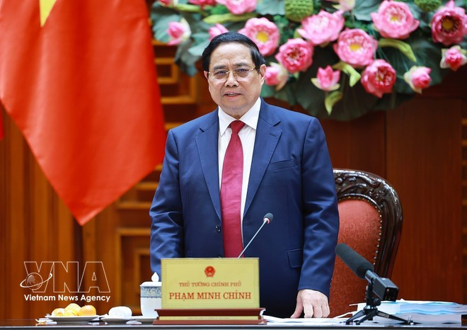 Премьер-министр Фам Минь Тьинь председательствует на третьем заседании Национального руководящего комитета по всеобъемлющему финансированию. (Фото: ВИА)