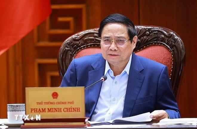 Премьер-министр Фам Минь Тьинь председательствует на заседании Постоянного комитета Правительства по развитию Проекта. (Фото: ВИА)