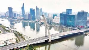 Город Хошимин ожидает, что Международный финансовый центр создаст возможности для привлечения зеленого капитала в целях реализации задач по сокращению выбросов. (Фото: Тунг Ань)