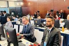 Международные представители наблюдают за работой XIV съезда в Национальном конференц-центре. Фото: ВИА