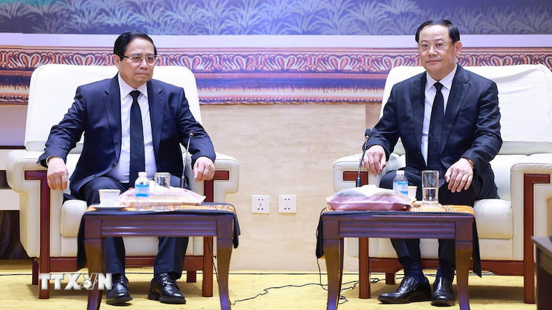 Премьер-министр Фам Минь Тьинь и Премьер-министр Лаоса Сонексай Сипхандон. Фото: ВИА