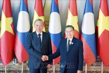 Генеральный секретарь То Лам проводит встречу с Председателем Национального собрания Лаоса Сайсомпоном Фомвиханом. (Фото: ВИА)