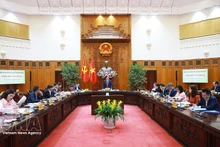 Премьер-министр Фам Минь Тьинь председательствует на третьем заседании Национального руководящего комитета по всеобъемлющему финансированию. (Фото: ВИА)