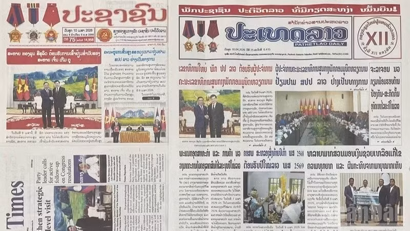 В крупных лаосских газетах опубликованы статьи, посвященные официальному визиту товарища Чан Кам Ту. Фото: Зюи Тоан