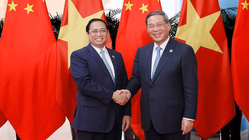 Премьер-министр Фам Минь Тьинь и Премьер Госсовета Китая Ли Цян. Фото: ВИА