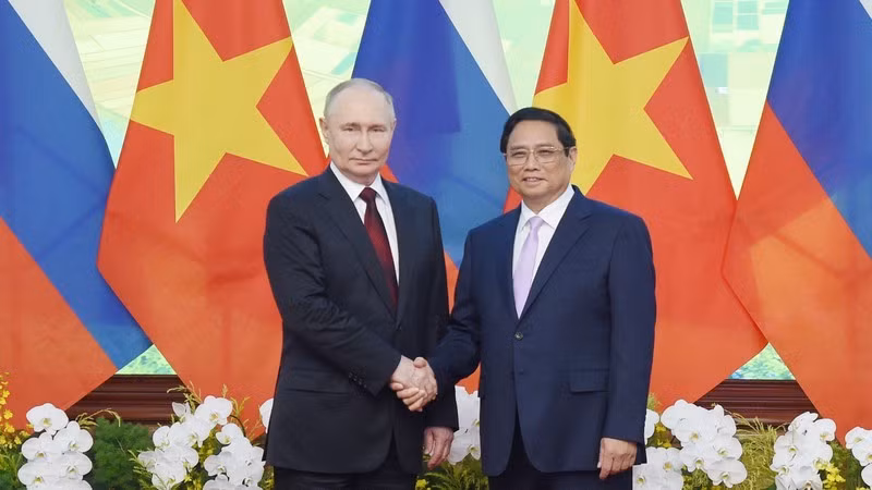 Премьер-министр Фам Минь Тьинь и Президент Путин. Фото: Чан Хай
