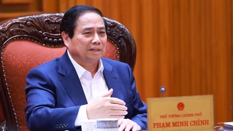 Премьер-министр Фам Минь Тьинь выступает на заседании. Фото: Чан Хай
