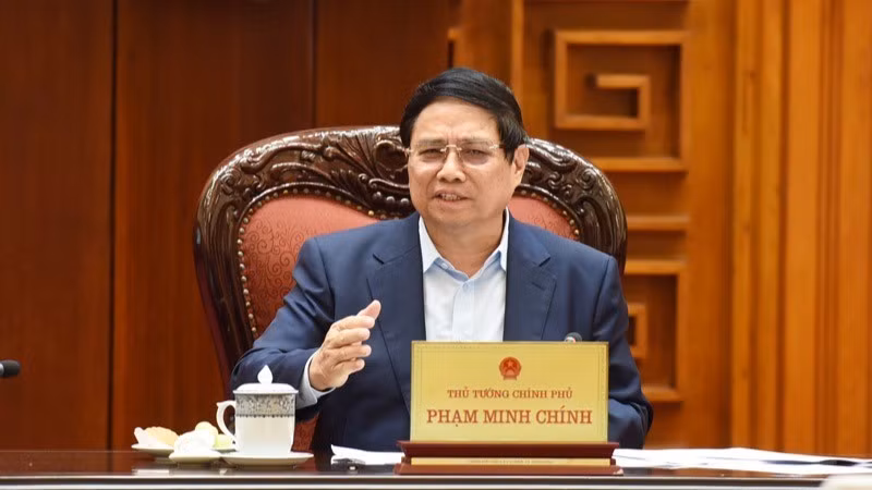 Премьер-министр Фам Минь Тьинь выступает на заседании. Фото: Чан Хай