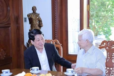 Президент Лыонг Кыонг и бывший Президент Нгуен Минь Чиет. Фото: Суан Ки