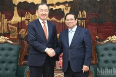 Премьер-министр Фам Минь Тьинь принимает Председателя Коллегии ЕЭК Бакытжана Сагинтаева. Фото: Чан Хай