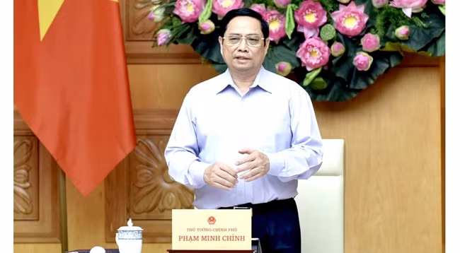 Премьер-министр Вьетнама Фам Минь Тьинь выступает на конференции. Фото: Чан Хай