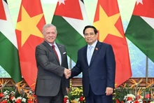 Премьер-министр Фам Минь Тьинь и Король Абдалла II ибн аль-Хусейн. Фото: Чан Хай