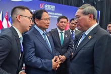 Премьер-министр Фам Минь Тьинь встречается с Премьером Госсовета Китая Ли Цяном. Фото: МИД Вьетнама